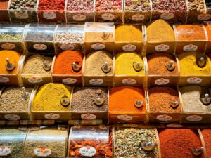 A colorful display of spices at a market in İstanbul, showcasing vibrant hues and diverse aromas.